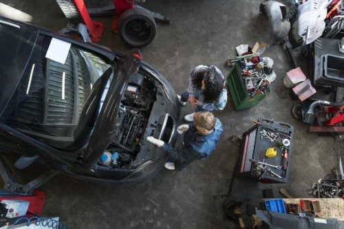 top-view-man-repairing-car_converted